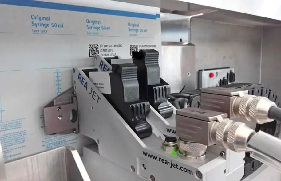 Marking of packaging material with ink